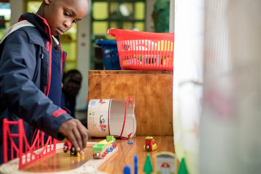 Tevin, one of our patients, in the playroom was giving some serious attention to his toys. (Nelson Muoki).
